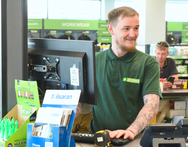 Store employee at checkout counter