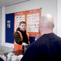 Branch colleague assists customer at service desk