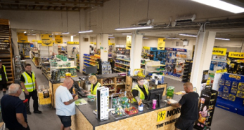 People at hardware store service counter