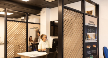 Person at reception desk in showroom office