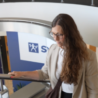 Employee walks through office lobby at headquarters