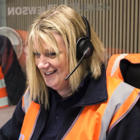 Staff member using headset at customer service desk