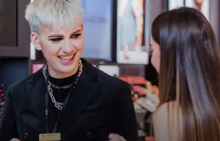 Employee assisting customer in cosmetics